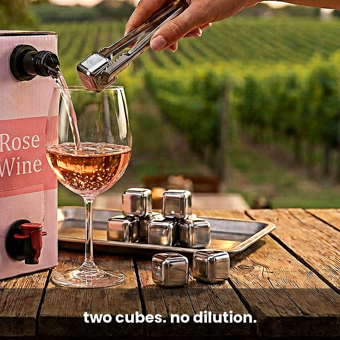 Steel cubes going into a glass of rosé, no dilution